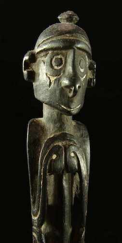 Papua New Guinea Figurine on the end of a massim spatula