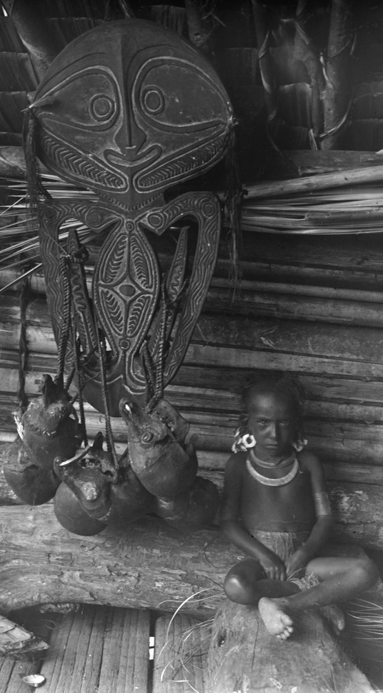 Native Fijian warrior with war clubs